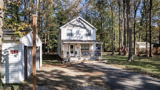 view of front of home featuring a porch and a garage