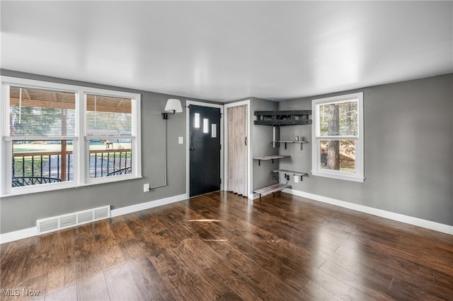 interior space with dark hardwood / wood-style floors