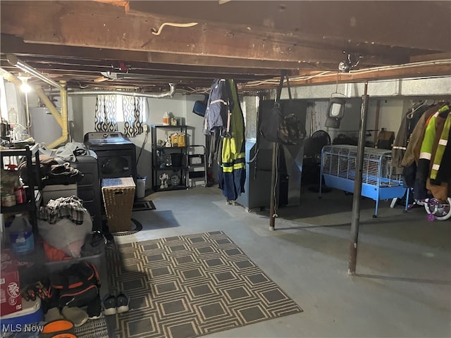 basement featuring washer / dryer and water heater