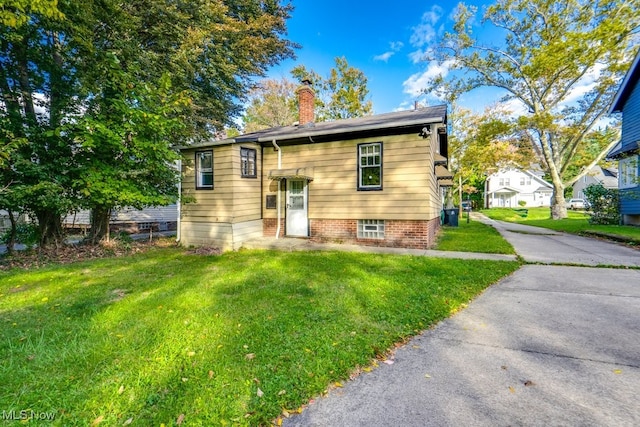 bi-level home with a front yard