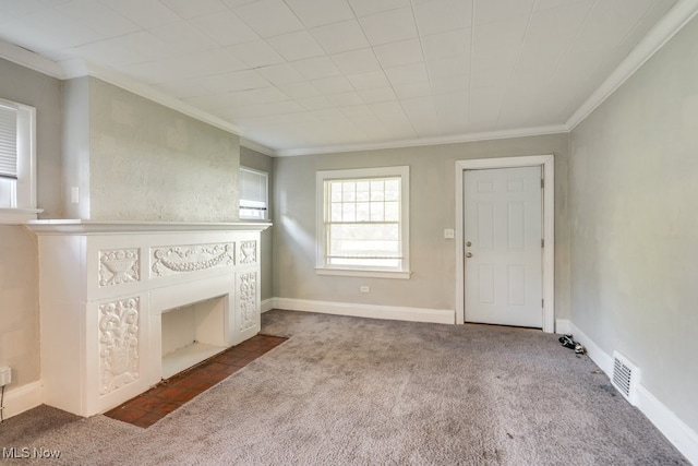 unfurnished living room with carpet and ornamental molding