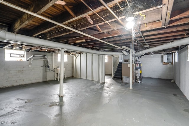 basement with water heater and electric panel