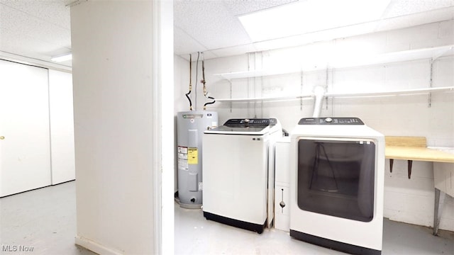 laundry area featuring independent washer and dryer and electric water heater