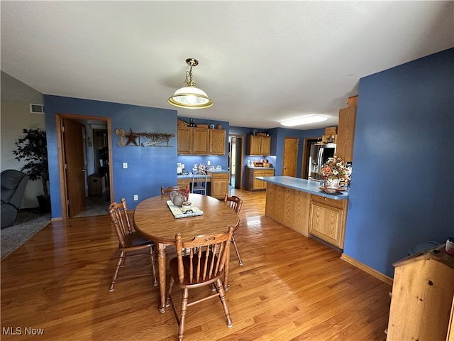 dining room featuring light hardwood / wood-style flooring