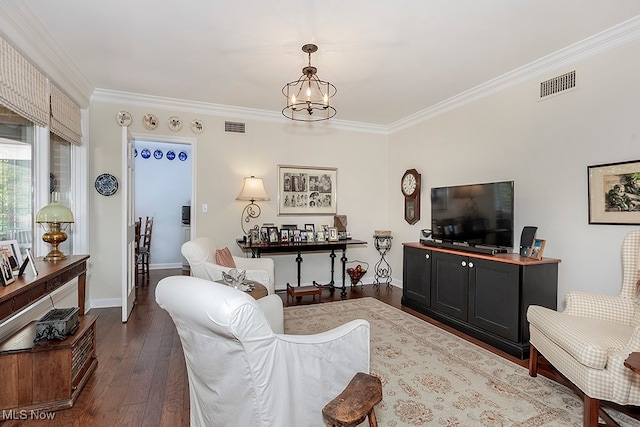 living room with ornamental molding, a notable chandelier, and dark hardwood / wood-style flooring