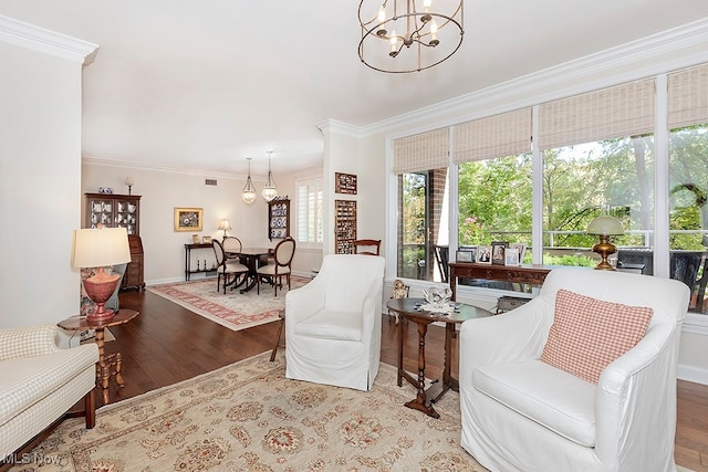 interior space featuring a notable chandelier, hardwood / wood-style flooring, and crown molding