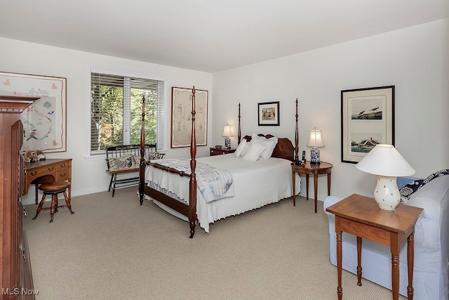 bedroom featuring light carpet