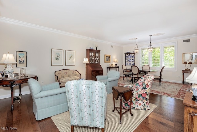 living room with crown molding and dark hardwood / wood-style floors