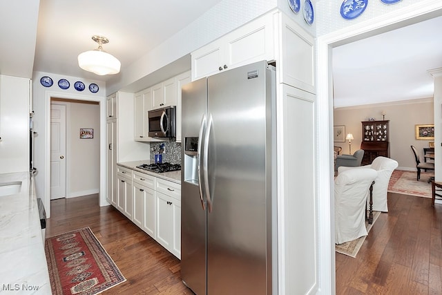 kitchen featuring dark wood-type flooring, white cabinetry, and stainless steel appliances