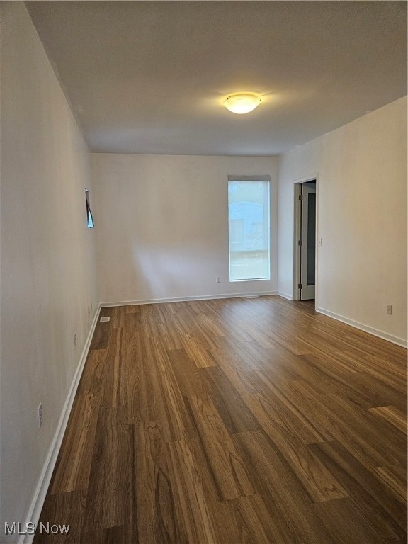 empty room featuring dark hardwood / wood-style floors