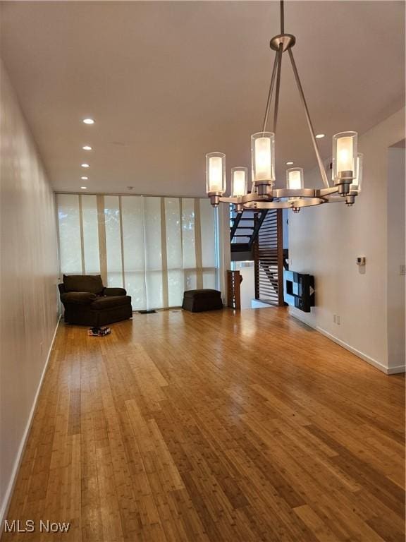11803 Euclid Ave, Cleveland, OH 44106 - dining space with hardwood / wood-style floors, stairway, baseboards, a chandelier, and recessed lighting