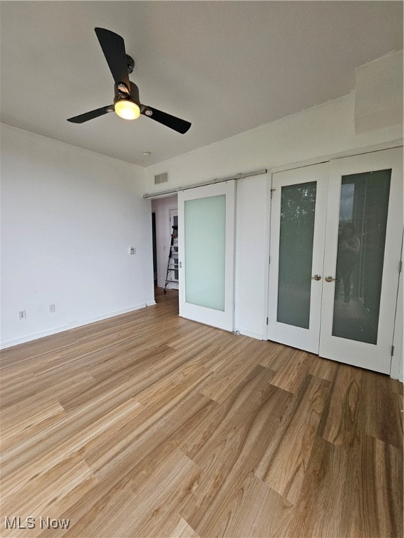 empty room featuring light hardwood / wood-style floors and ceiling fan