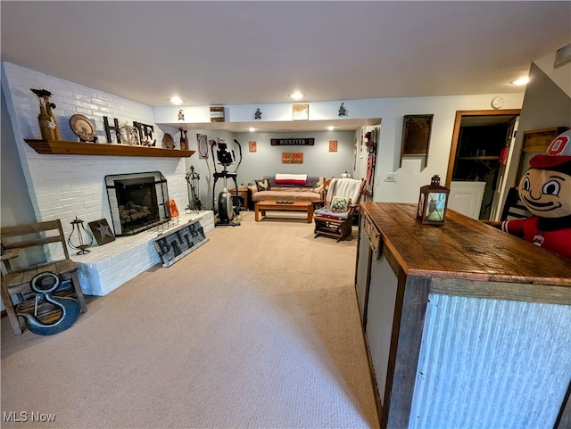 carpeted living room featuring a brick fireplace