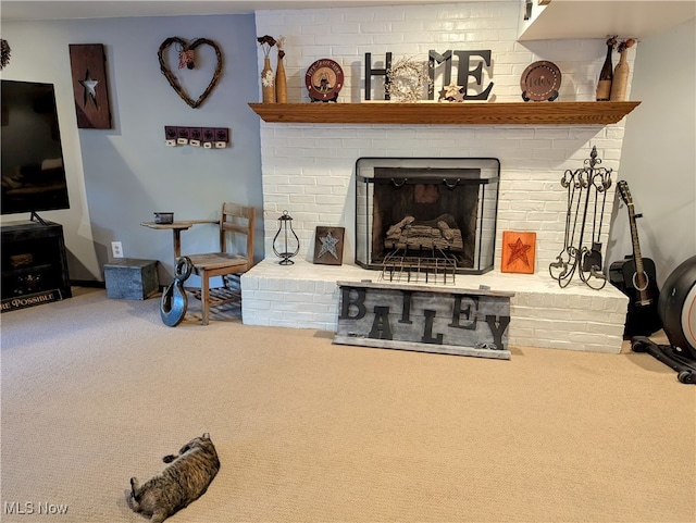 living room featuring a brick fireplace and carpet floors