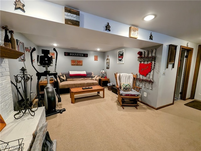 living room featuring light carpet and a brick fireplace