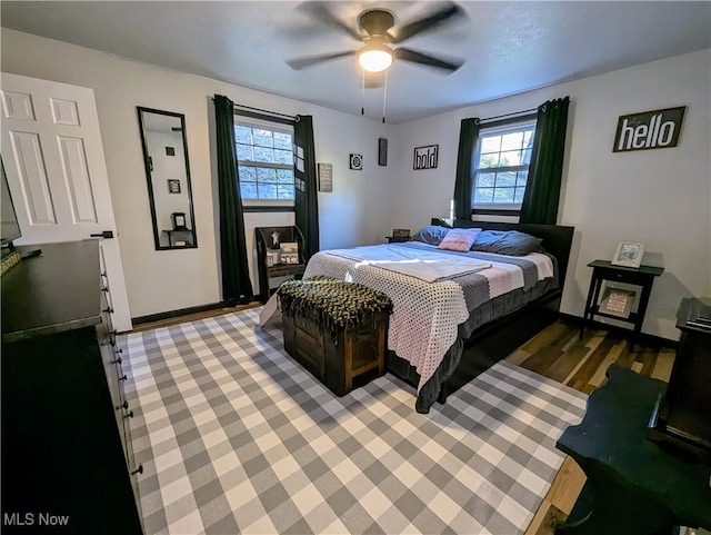 bedroom featuring wood-type flooring and ceiling fan