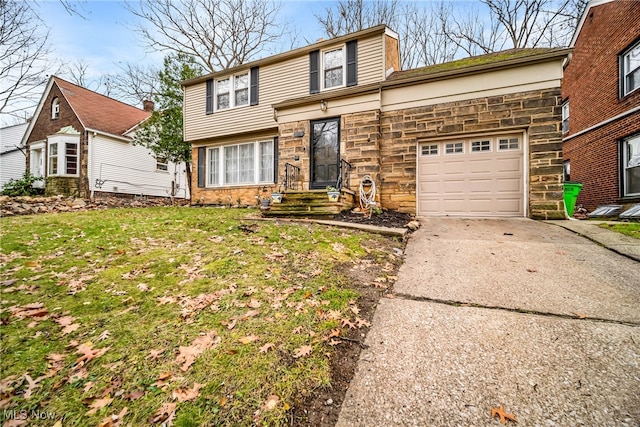 view of front property with a garage and a front lawn