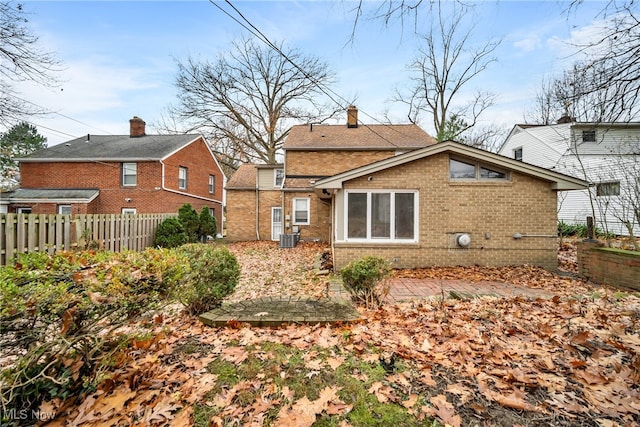 rear view of house with a patio area and central AC unit