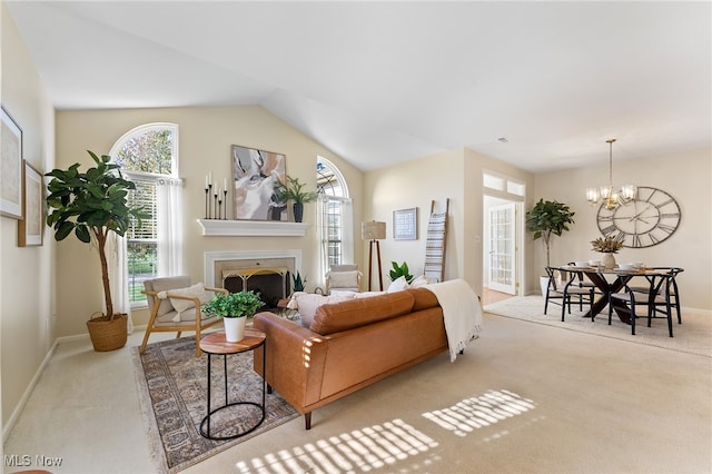 living room with a notable chandelier, vaulted ceiling, and light carpet