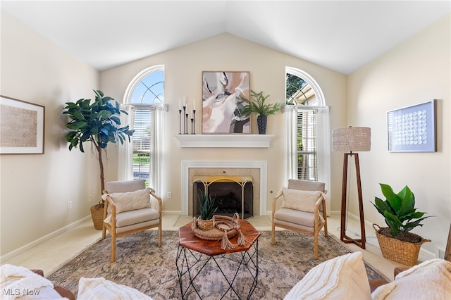 sitting room featuring carpet, a fireplace, and vaulted ceiling