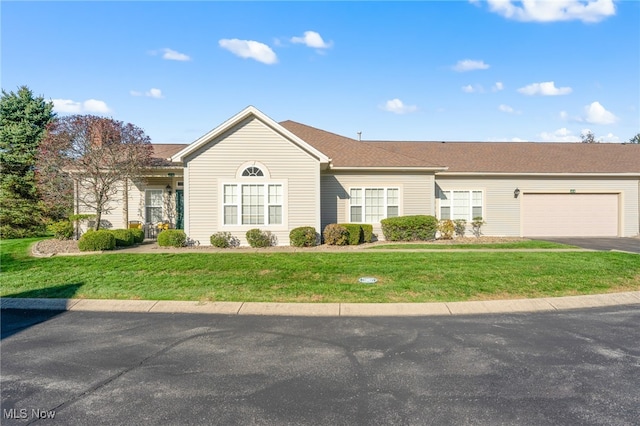 single story home with a front lawn and a garage