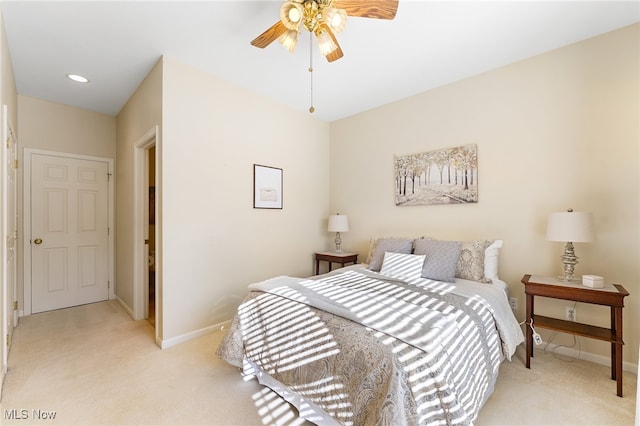 bedroom with light carpet and ceiling fan