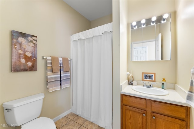 bathroom featuring vanity, toilet, and tile patterned floors