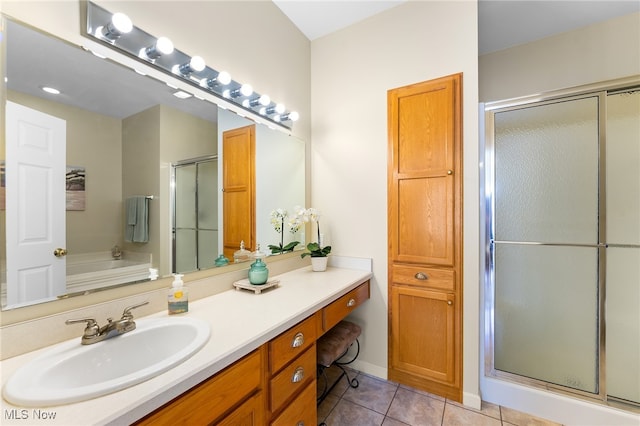 bathroom with vanity, plus walk in shower, and tile patterned floors