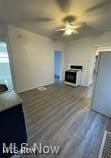 unfurnished living room featuring dark wood-type flooring