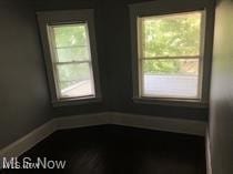 unfurnished room featuring plenty of natural light