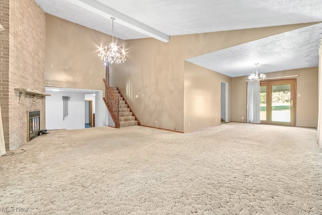 unfurnished living room with a textured ceiling, vaulted ceiling with beams, carpet floors, and an inviting chandelier