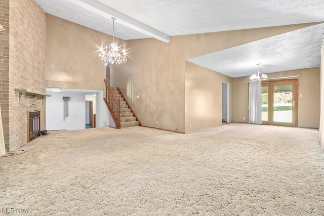 unfurnished living room with a textured ceiling, vaulted ceiling with beams, carpet floors, and a chandelier