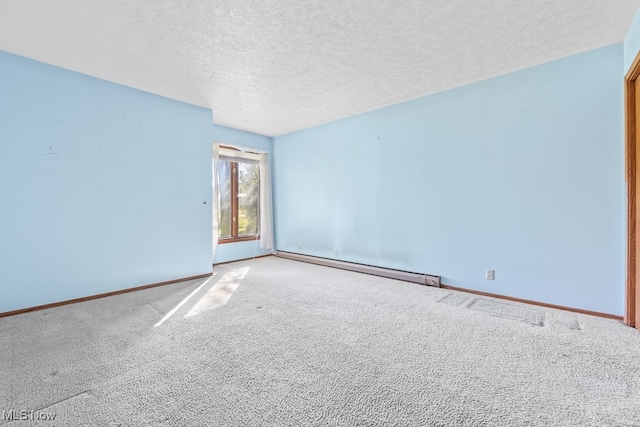 unfurnished room featuring a baseboard heating unit, a textured ceiling, and light colored carpet