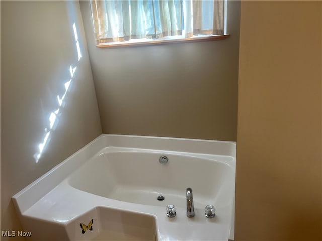 bathroom featuring a bath