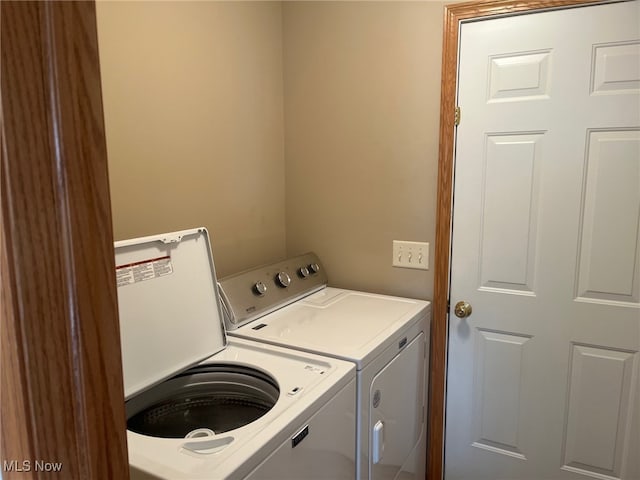 laundry area with separate washer and dryer