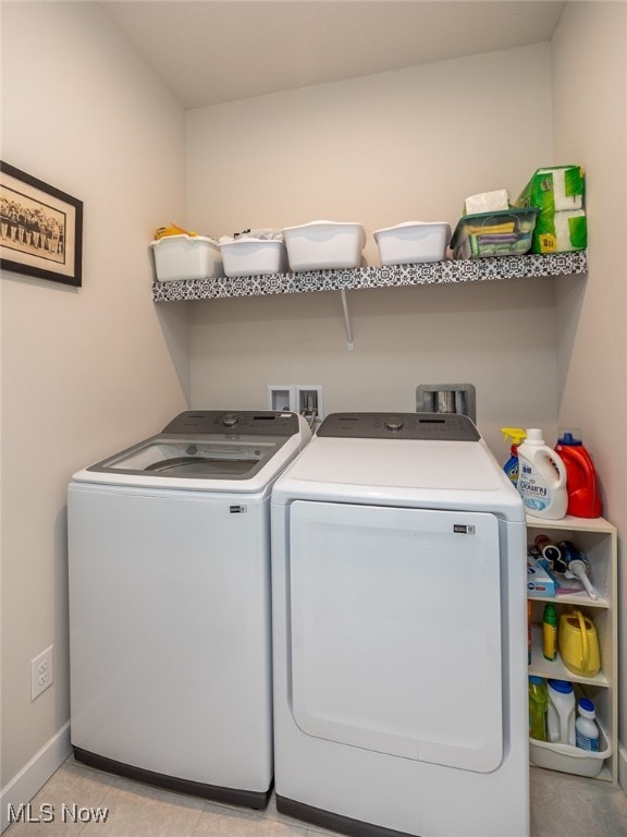 laundry area featuring washing machine and clothes dryer