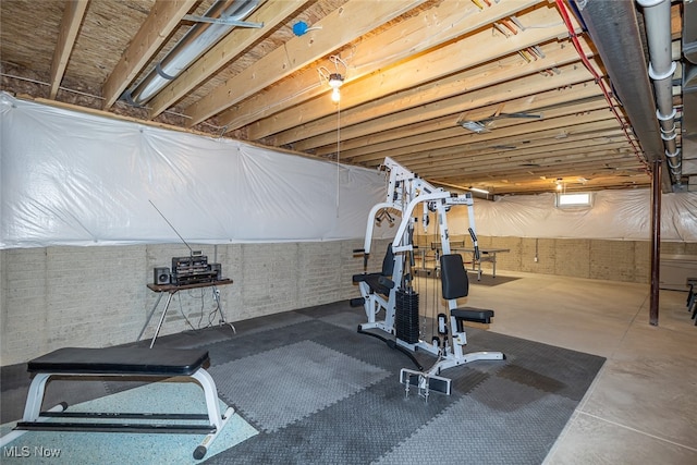 exercise room featuring concrete flooring