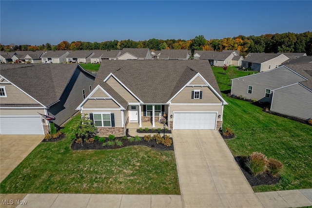 craftsman house featuring a front yard and a garage