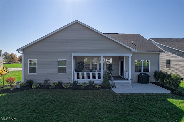 view of front of home with a front lawn and a porch