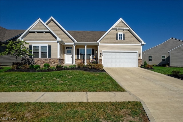 craftsman inspired home with a front yard and a garage