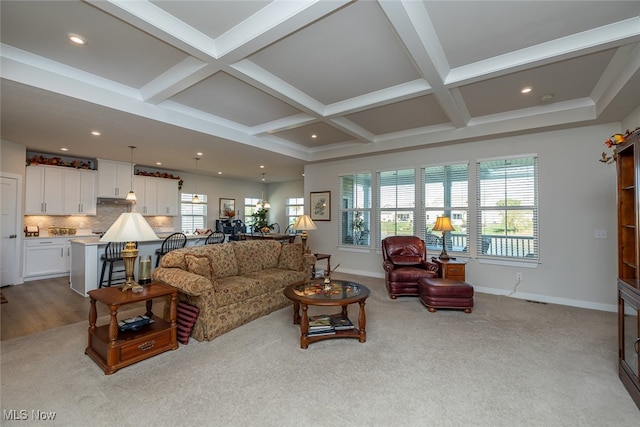 living room featuring beam ceiling, coffered ceiling, and light carpet