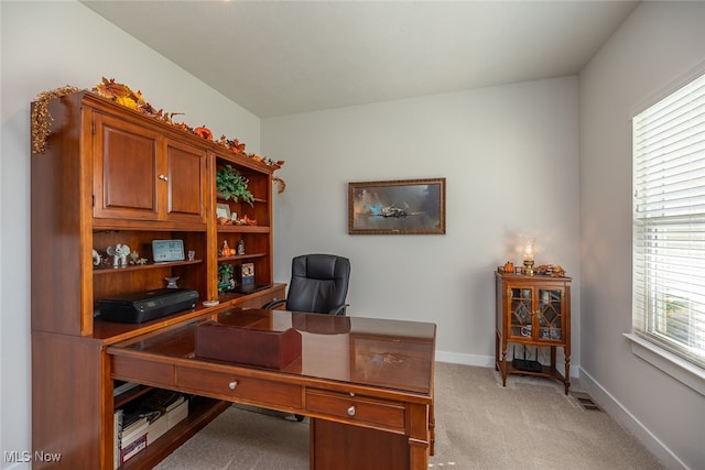 office with light carpet and a healthy amount of sunlight