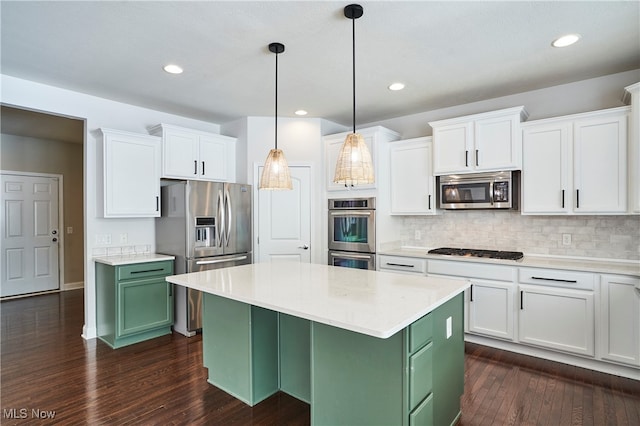 kitchen with dark wood-type flooring, white cabinets, stainless steel appliances, and green cabinets