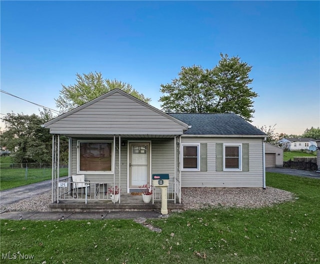 bungalow featuring a porch and a front yard