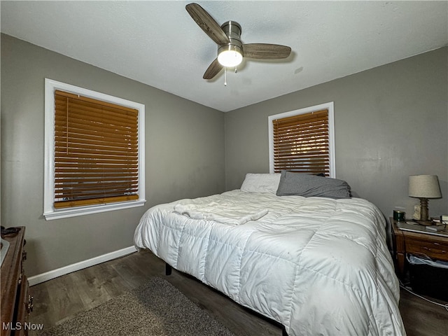 bedroom featuring dark hardwood / wood-style floors and ceiling fan