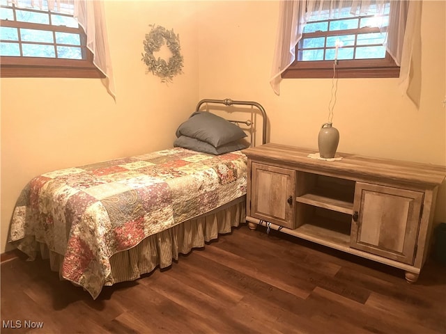 bedroom featuring dark hardwood / wood-style flooring