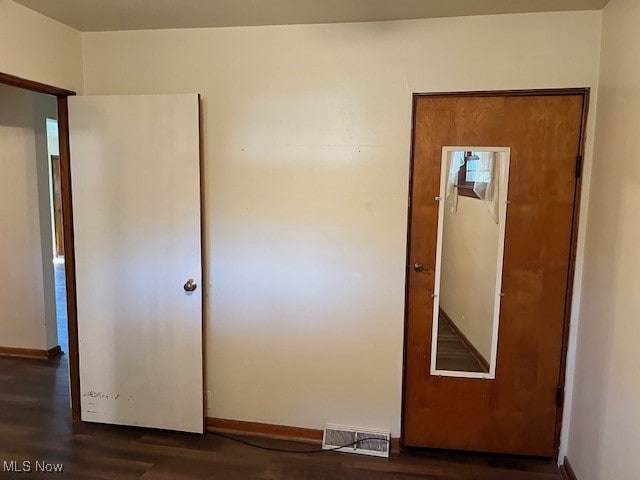 interior space with dark wood-type flooring