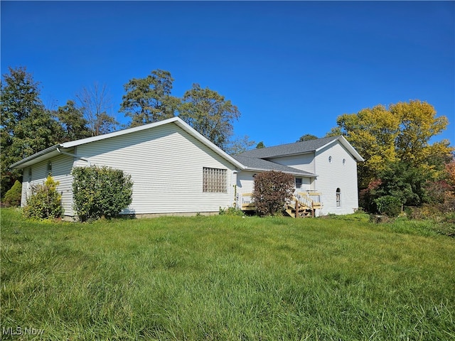 view of home's exterior featuring a yard