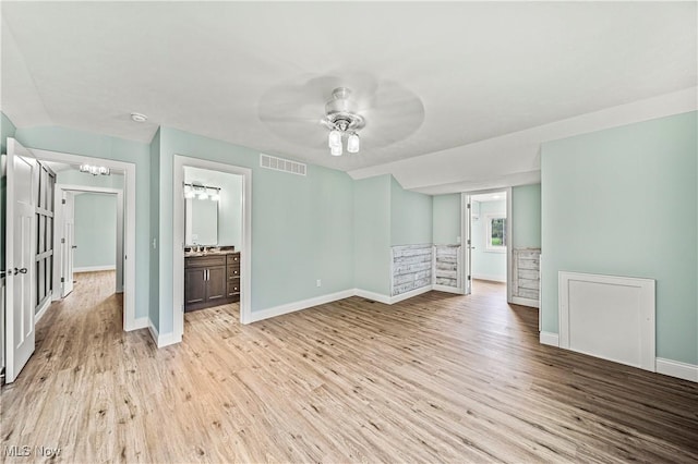 spare room featuring ceiling fan and light hardwood / wood-style floors