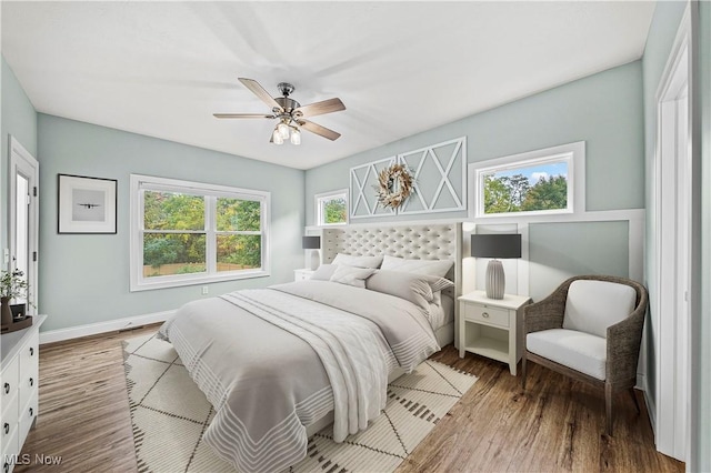 bedroom featuring hardwood / wood-style flooring and ceiling fan